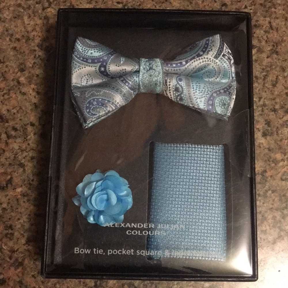 Bow tie, pocket square and lapel button